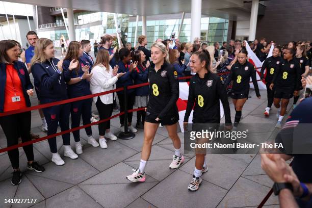 Alessia Russo and Katie Zelem of England arrive for a training session as staff create a guard of honour during an England FIFA Women's World Cup...