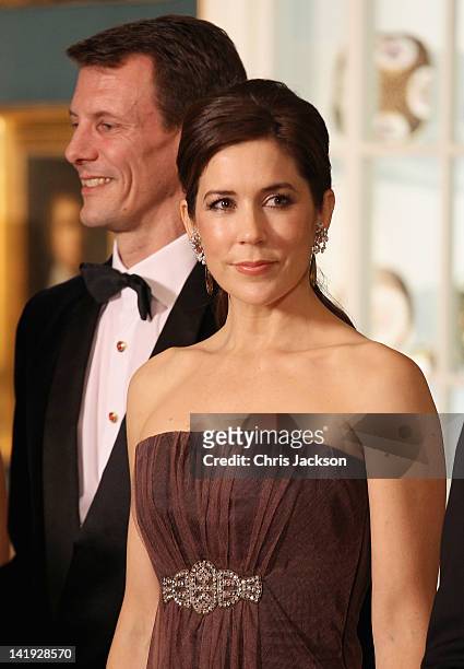 Crown Princess Mary of Denmark and Prince Joachim of Denmark take part in a receiving line ahead of an official dinner at the Royal Palace on March...