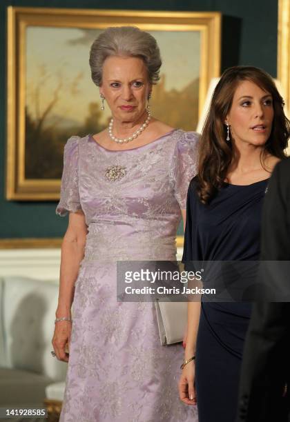 Princess Benedikte of Denmark and Princess Marie of Denmark take part in a receiving line ahead of an official dinner at the Royal Palace on March...