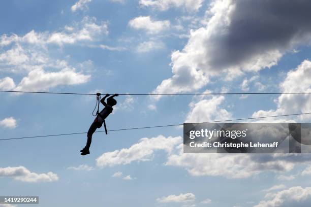teenager doing tree climbing, france - cable de tirolina fotografías e imágenes de stock