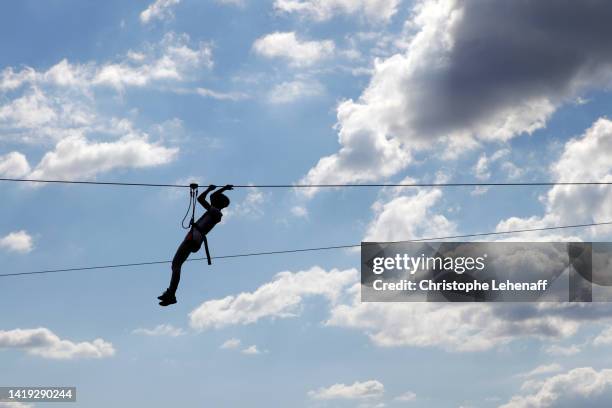 teenager doing tree climbing, france - zip line fotografías e imágenes de stock