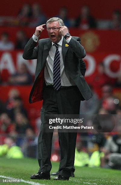 Sir Alex Ferguson of Manchester United shouts instructions from the touchline during the Barclays Premier League match between Manchester United and...