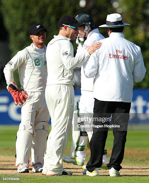 Brendon McCullum of New Zealand talks to umpire Aleem Dar of Pakistan after an unsuccessful appeal during day five of the Third Test match between...