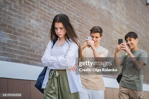 Teenage girl being bullied at school Teenage girl being bullied at school