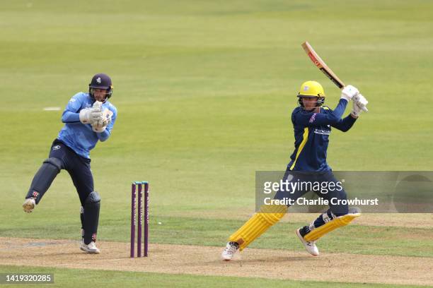 Aneurin Donald of Hampshire hits out while Kent keeper Ollie Robinson looks on during the Royal London Cup Semi Final between Hampshire and Kent...