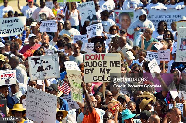 Thousands of protestors march through the streets in support of slain teenager Trayvon Martin on March 26, 2012 in Sanford, Florida. The teenager's...