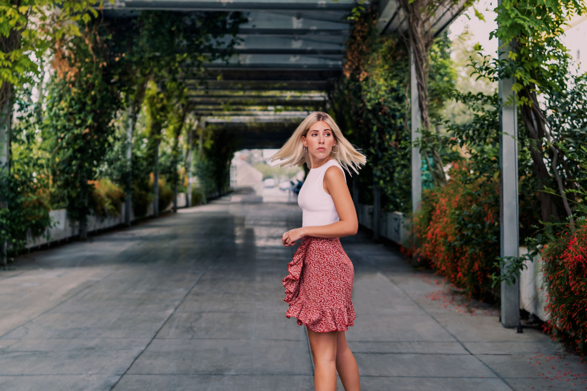 A blonde girl walking who suddenly turns around. Profile view. A blonde girl walking who suddenly turns around. Profile view.