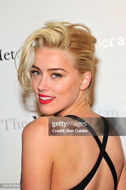 Amber Heard attends the Metropolitan Opera gala premiere Of Jules Massenet's "Manon" at The Metropolitan Opera House on March 26, 2012 in New York...