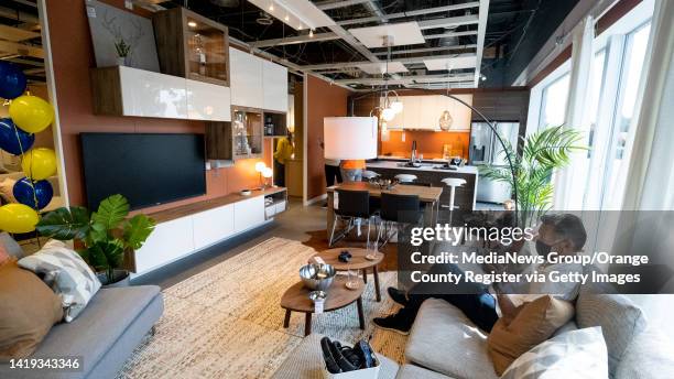 August 29: A man takes a break on a couch at the new IKEA Planning Studio in Long Beach, CA on Monday, August 29, 2022. The 8,000-square-foot space...