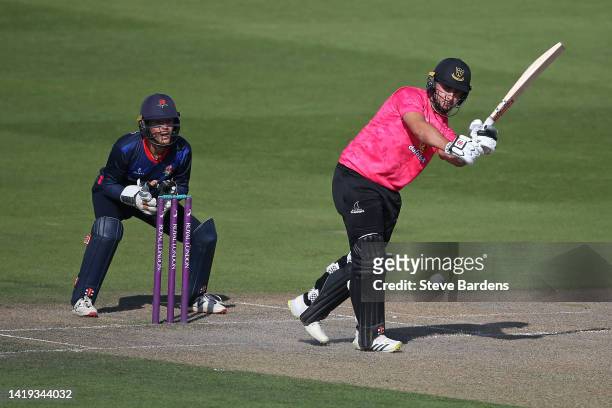 Tom Haines of Sussex Sharks plays a shot as George Lavelle of Lancashire Lightning looks on during the Royal London Cup semi final match between...