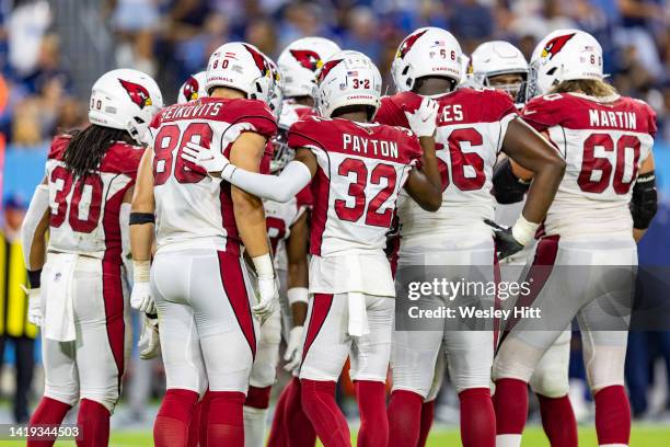 Offense of the Arizona Cardinals huddle together during a preseason game against the Tennessee Titans at Nissan Stadium on August 27, 2022 in...