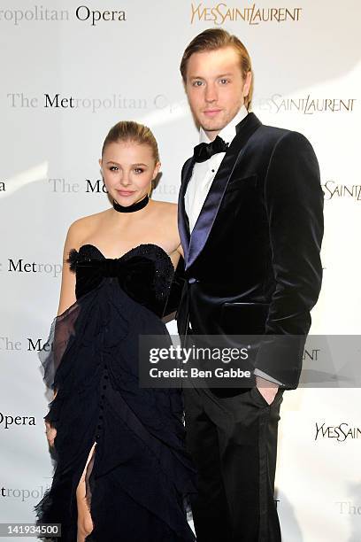 Chloe Moretz and guest attend the Metropolitan Opera gala premiere Of Jules Massenet's "Manon" at The Metropolitan Opera House on March 26, 2012 in...