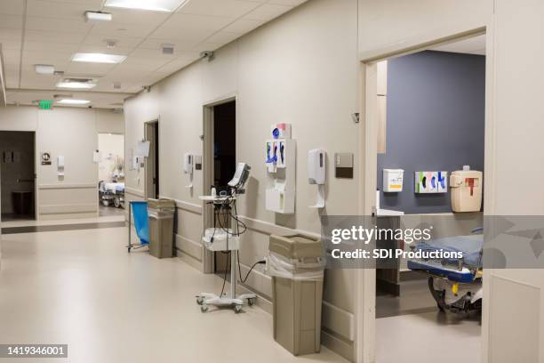 view from corridor of emergency examination rooms - er door stock pictures, royalty-free photos & images