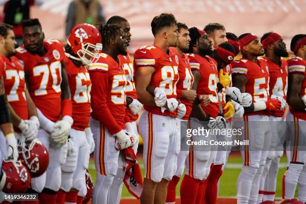 Kansas City Chiefs players lock arms for a moment of unity before an NFL game against the Houston Texans, Sunday, Sep. 10 in Kansas City, Mo.