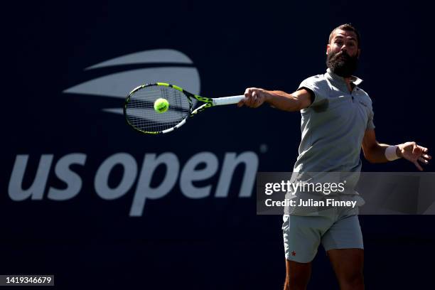 Benoit Paire of France plays a forehand against Cameron Norrie of Great Britain in their M's Singles First Round match on Day Two of the 2022 US Open...