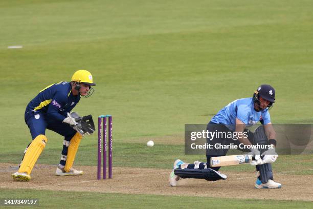 Harry Finch of Kent celebrates hits out while Ben Brown of Hampshire tends the wicket during the Royal London Cup Semi Final between Hampshire and...