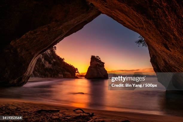 scenic view of sea seen through cave,coromandel,new zealand - halbinsel coromandel peninsula stock-fotos und bilder