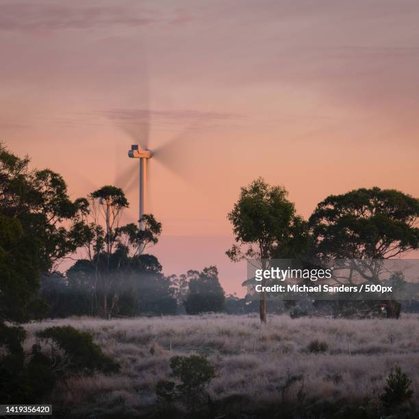 silhouette of wind turbines on field against sky during sunset,lal lal,victoria,australia - wind farm australia fotografías e imágenes de stock