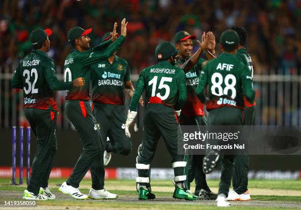 Players of Pakistan celebrates the wicket of Rahmanullah Gurbaz of Afghanistan during the DP World T20 match between Bangladesh v Afghanistan at...