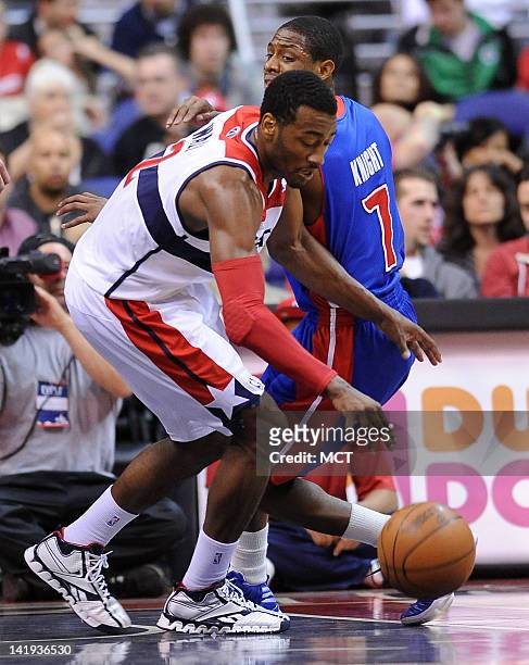 Washington Wizards point guard John Wall collects a turnover by Detroit Pistons point guard Brandon Knight during second-half action at the Verizon...