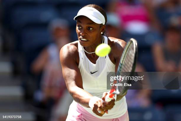 Sloane Stephens of the United States returns a shot against Greet Minnen of Belgium in their Women's Singles First Round match on Day Two of the 2022...