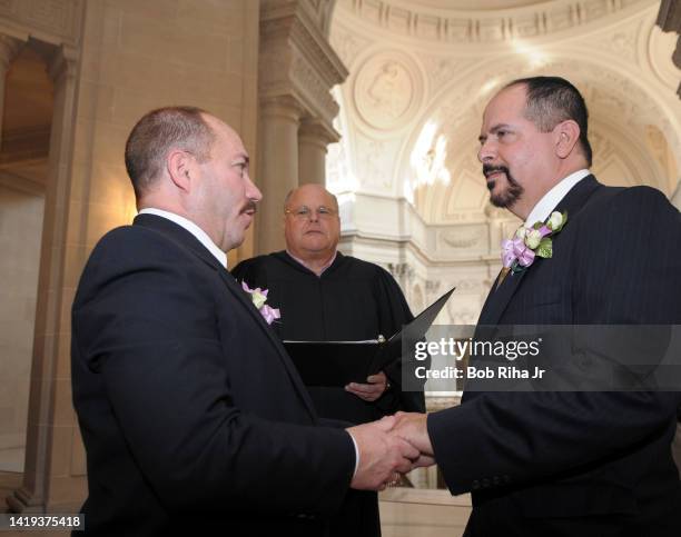 Robert Makowka celebrates after being married to his partner Jay Dabbs, both from San Francisco by Marriage Commissioner Bob Wertz inside San...