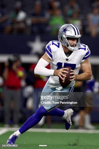 Quarterback Jacob Eason of the Seattle Seahawks looks for an open receiver against the Seattle Seahawks in the fourth quarter of a NFL preseason...