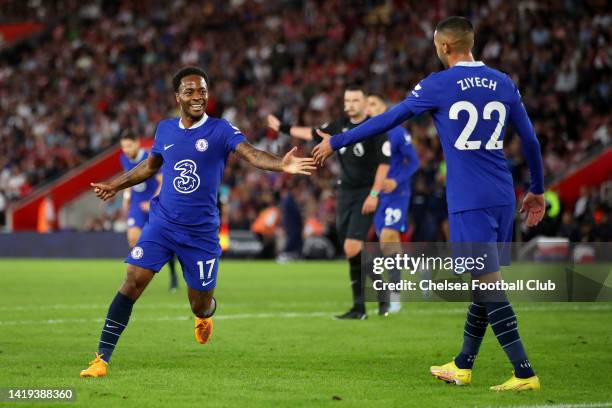 Raheem Sterling of Chelsea celebrates with teammate Hakim Ziyech after scoring their team's first goal during the Premier League match between...