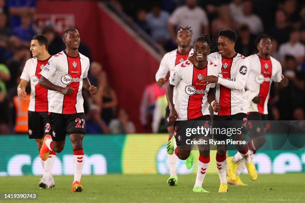 Romeo Lavia of Southampton celebrates with teammates after scoring their team's first goal during the Premier League match between Southampton FC and...