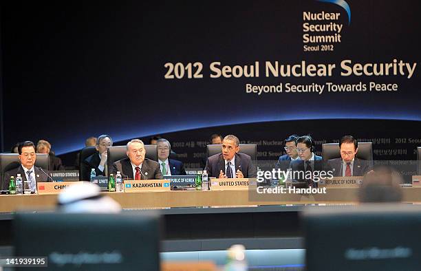 In this handout image provided by Yonhap News, U.S. President Barack Obama speaks while Chinese President Hu Jintao , Kazakhstan President Nursultan...