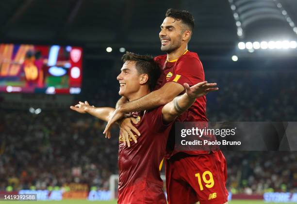Paulo Dybala of AC Monza celebrates after scoring their team's second goal with teammate Samuele Birindelli during the Serie A match between AS Roma...