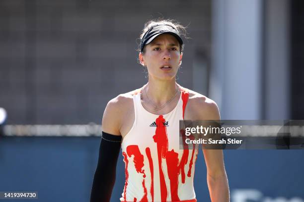 Andrea Petkovic of Germany looks on against Belinda Bencic of Switzerland in their Women's Singles First Round match on Day Two of the 2022 US Open...