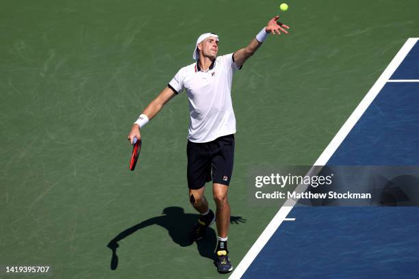 John Isner of the United States serves against Federico Delbonis of Argentina in their Men's Singles First Round match on Day Two of the 2022 US Open...