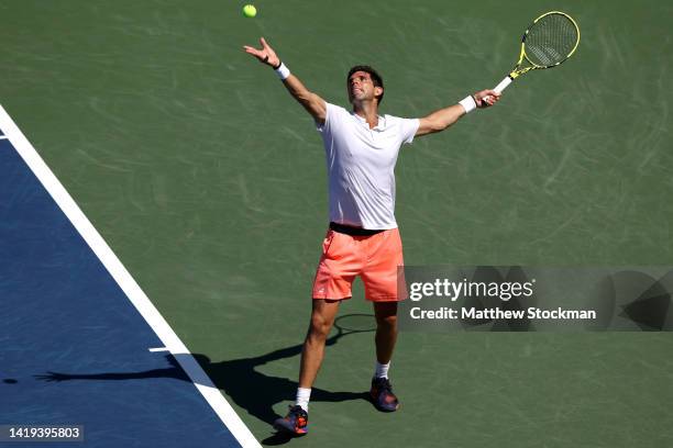 Federico Delbonis of Argentina serves against John Isner of the United States in their Men's Singles First Round match on Day Two of the 2022 US Open...