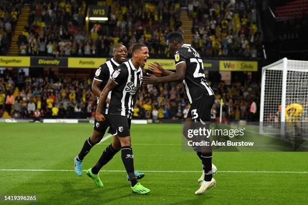 Ismaila Sarr of Watford celebrates with teammate Joao Pedro after scoring their team's first goal during the Sky Bet Championship between Watford and...