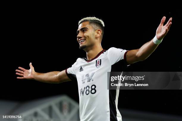 Andreas Pereira of Fulham celebrates after their team's second goal, an own goal scored by Lewis Dunk of Brighton & Hove Albion during the Premier...