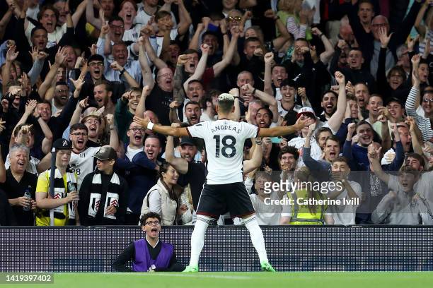 Andreas Pereira of Fulham celebrates after their team's second goal, an own goal scored by Lewis Dunk of Brighton & Hove Albion during the Premier...
