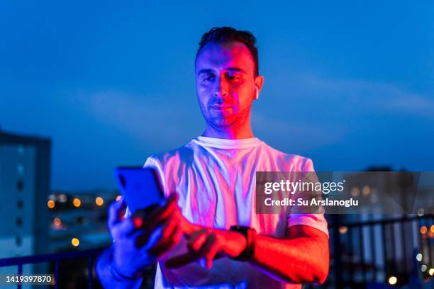 Man Using Cell Phone Light Face 504 Phone Face Neon Stock Photos, High-Res Pictures, and Images - Getty ...