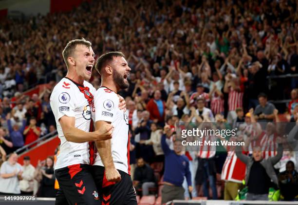 Adam Armstrong of Southampton celebrates with team mate James Ward-Prowse after putting his team 2-1 up during the Premier League match between...
