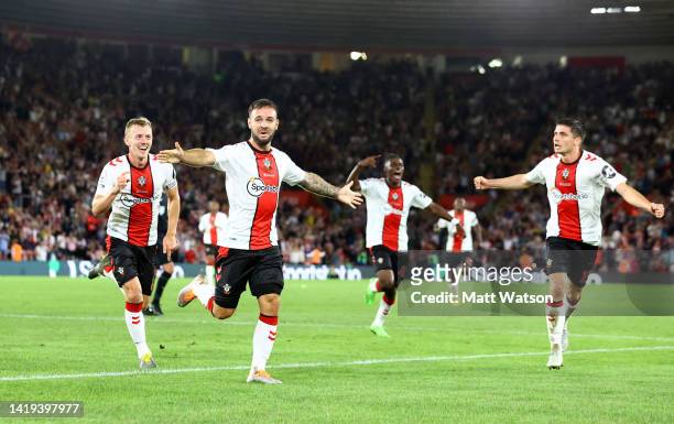 Adam Armstrong of Southampton celebrates with James Ward-Prowse and Romain Perraud after putting his team 2-1 up during the Premier League match...