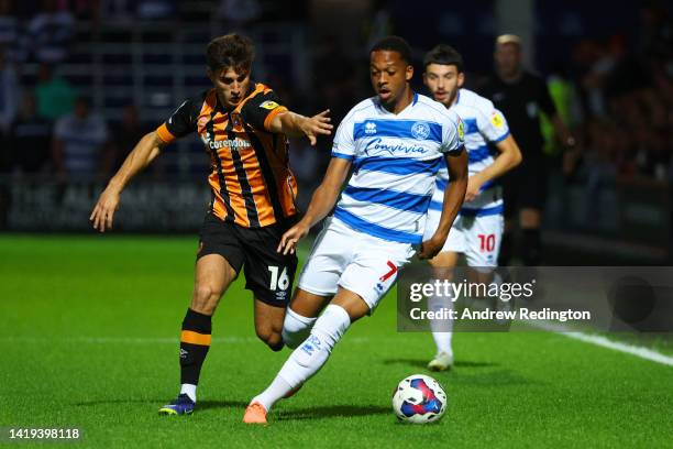 Chris Willock of Queens Park Rangers is challenged by Ryan Longman of Hull City during the Sky Bet Championship between Queens Park Rangers and Hull...