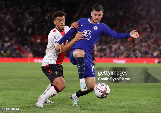 Mason Mount of Chelsea is challenged by Che Adams of Southampton during the Premier League match between Southampton FC and Chelsea FC at Friends...