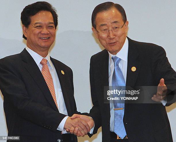 Secretary-General Ban Ki-moon gestures as he shakes hands with Prime Minister of Vietnam Nguyen Tan Dung during a bi-lateral meeting in Seoul on...