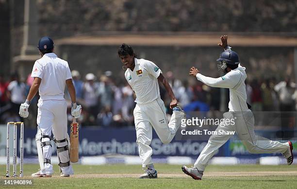 Suranga Lakmal of Sri Lanka celebrates taking the wicket of Alastair Cook of England during day 2 of the 1st test match between Sri Lanka and England...
