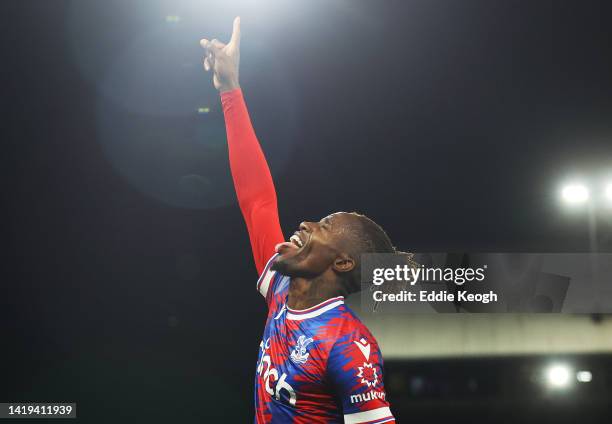 Wilfried Zaha of Crystal Palace celebrates after scoring their team's first goal during the Premier League match between Crystal Palace and Brentford...