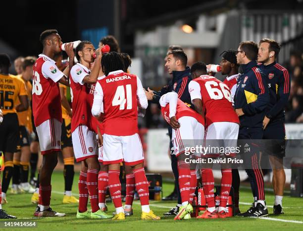 Arsenal U21 Head Coach Mehemt Ali talks to his players during the Papa John's match between cambridge United and Arsenal U21 at Abbey Stadium on...