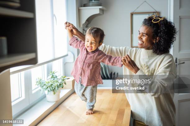 morning at home with baby - baby pullover stockfoto's en -beelden