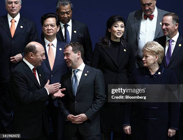 Traian Basescu, Romania's president, front row left, speaks with Dmitry Medvedev, Russia's president, center, as Dalia Grybauskaite, Lithuania's...