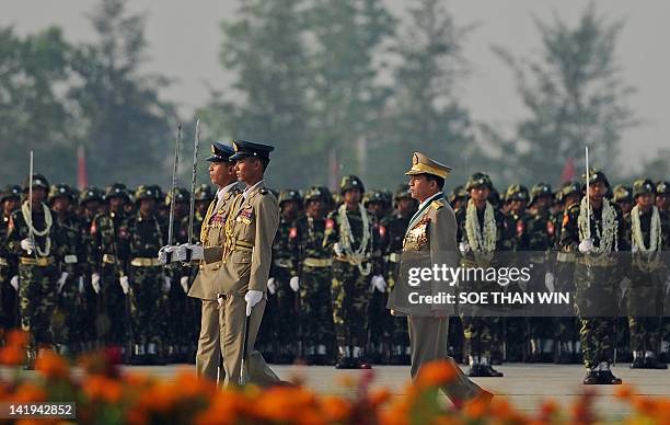 Myanmar's army chief General Min Aung Hlaing inspects troops during a ceremony marking the 67th anniversary of the Armed Forces Day in Naypyidaw on...