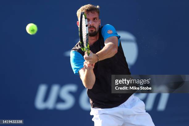 Oscar Otte of Germany returns a shot against Hubert Hurkacz of Poland in their Men's Singles First Round match on Day Two of the 2022 US Open at USTA...